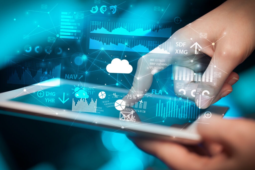 Hand using tablet with application icons flying around